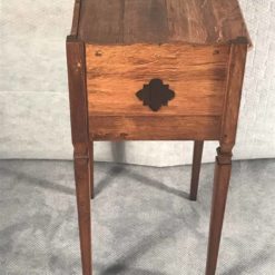 Two provincial nightstands- one of the two- side view with open work decor- styylish
