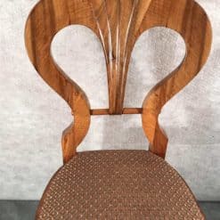 Six Biedermeier walnut chairs- one chair detail of the backrest- styylish