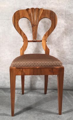 Six Biedermeier walnut chairs- one chair close up of the front- styylish