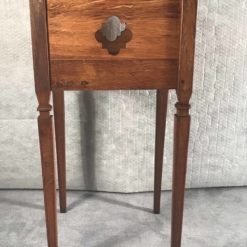 Two provincial nightstands- one of the two- side view with open work decor right- styylish