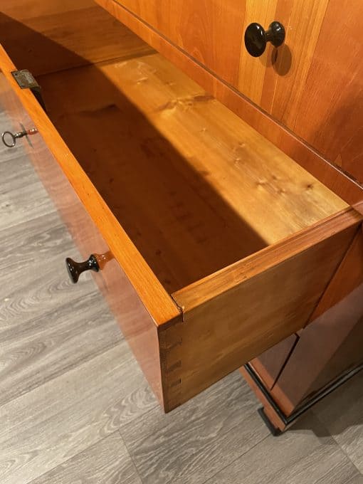Biedermeier cherry chest- view of an open drawer- styylish