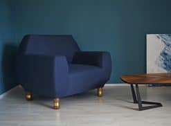 Upholstered Armchair- view of the blue covered armchair in a room- Styylish