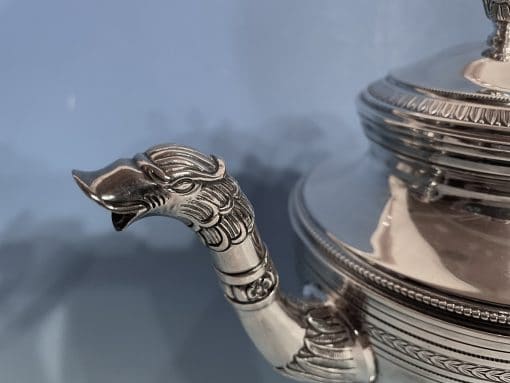 Silver coffee and tea set- detail of the spout of the tea pot- styylish