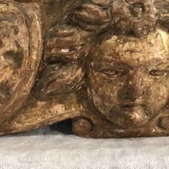 Baroque Gilt wood mirror- detail of the cherub head on the bottom- Styylish