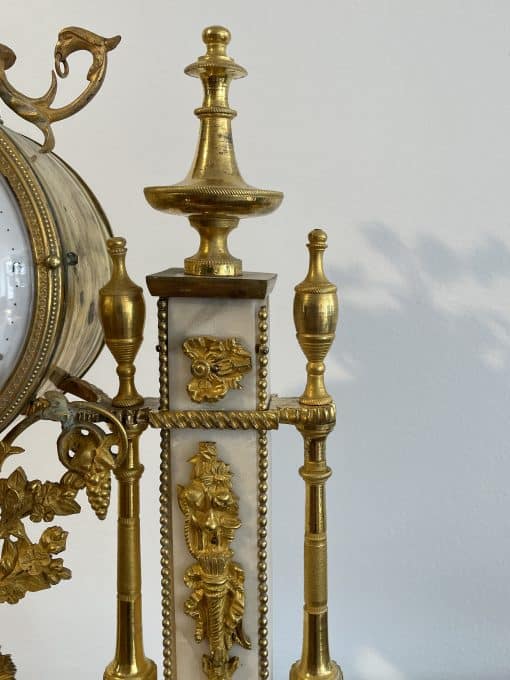 Louis XVI Mantel Clock- detail of the right side with white marble and ormolu- Styylish