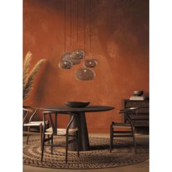 Round Pebble Glass Suspension Lamp- gold and silver above a table- Styylish