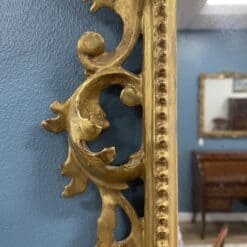 Hand-Carved Gilt Wood Mirror- detail of the left side- Styylish