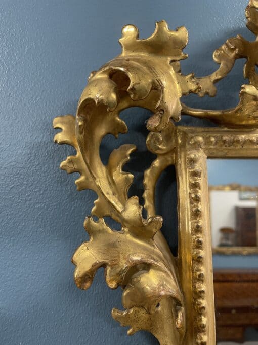 Hand-Carved Gilt Wood Mirror- detail of the upper left side- Styylish