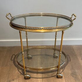 Oval neoclassical Brass Bar Cart, attributed to Maison Jansen.