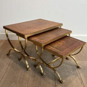 Set of Gilt Metal Nesting Tables with Claw Feet and Leather Tops Attributed by Maison Jansen