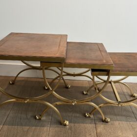 Set of Gilt Metal Nesting Tables with Claw Feet and Leather Tops Attributed by Maison Jansen