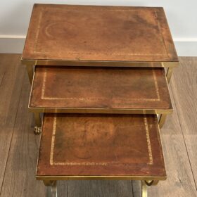 Set of Gilt Metal Nesting Tables with Claw Feet and Leather Tops Attributed by Maison Jansen