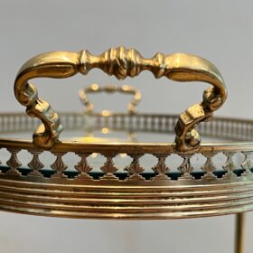 Oval neoclassical Brass Bar Cart, attributed to Maison Jansen.