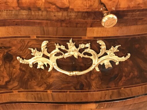 Original 18th century ormolu fittings on a German Baroque chest of drawers, highlighting historic craftsmanship and refined design- Styylish