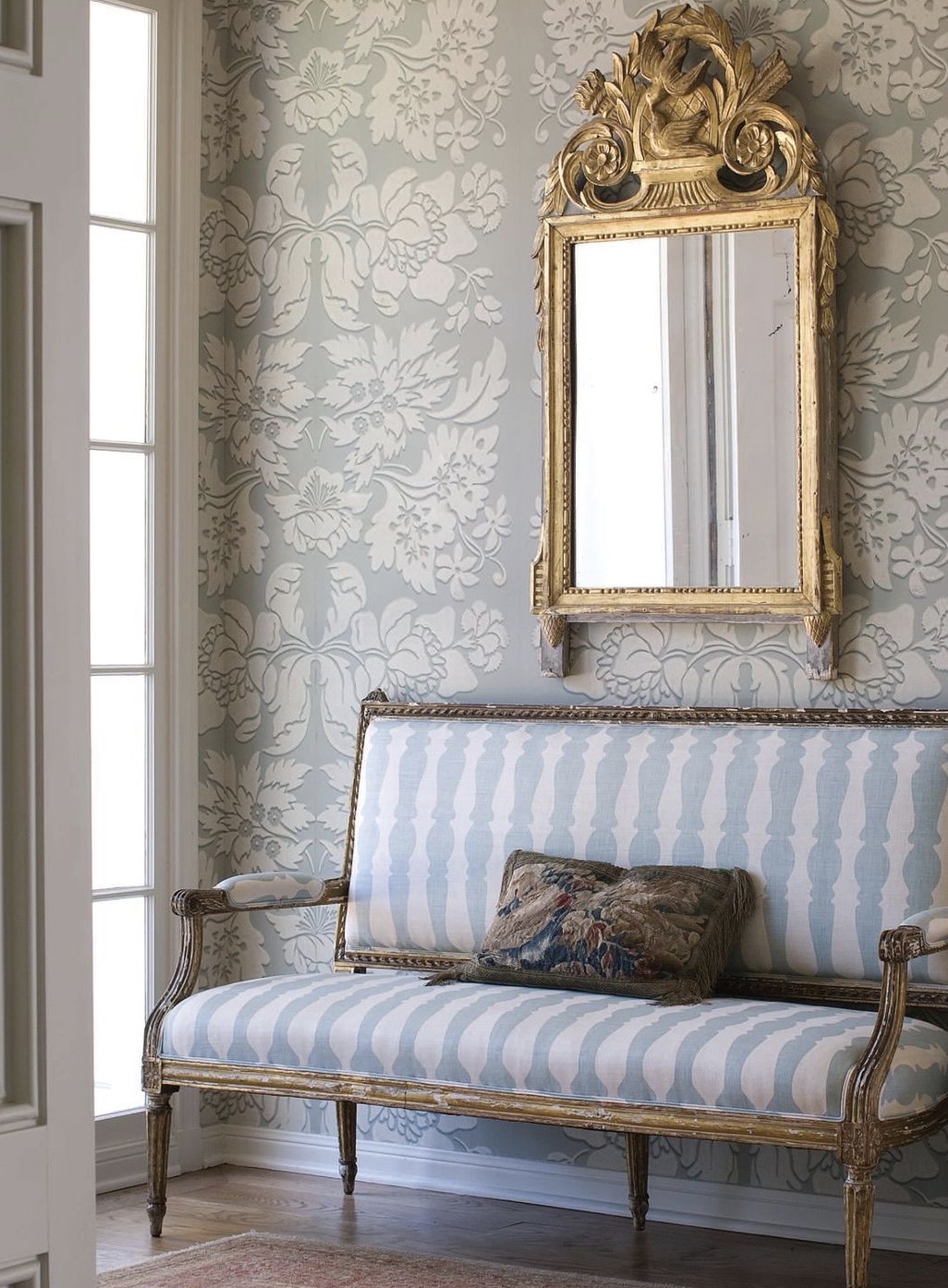 Louis XVI Settee with Louis XVI Mirror in an entryway- Styylish