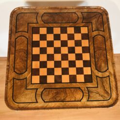 Close-up of maple and burlwood inlaid chessboard on Baroque table- Styylish