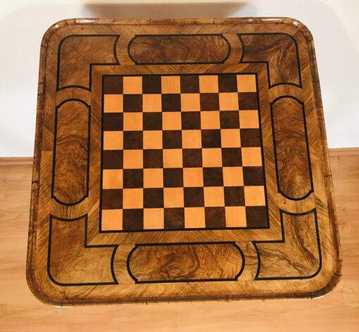 Close-up of maple and burlwood inlaid chessboard on Baroque table- Styylish