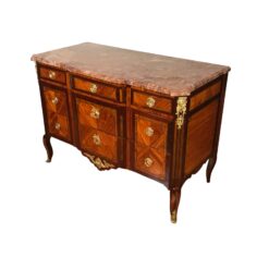 Side profile of 18th-century French Louis XV-Transition chest, highlighting elegant curved feet and refined veneer work.