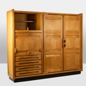 Guillerme and Chambron. Oak wardrobe with built-in writing desk. 1970s–80s