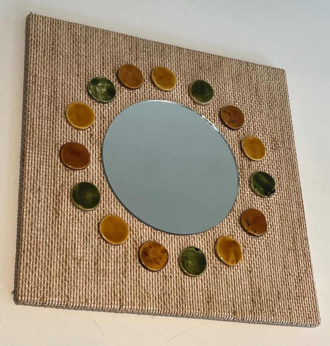 French Mid-Century Raffia and Ceramic Roundel Mirror - Angled View - Styylish