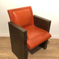 Pair of French 1970s Brown and Orange Leather Armchairs - Angled View - Styylish