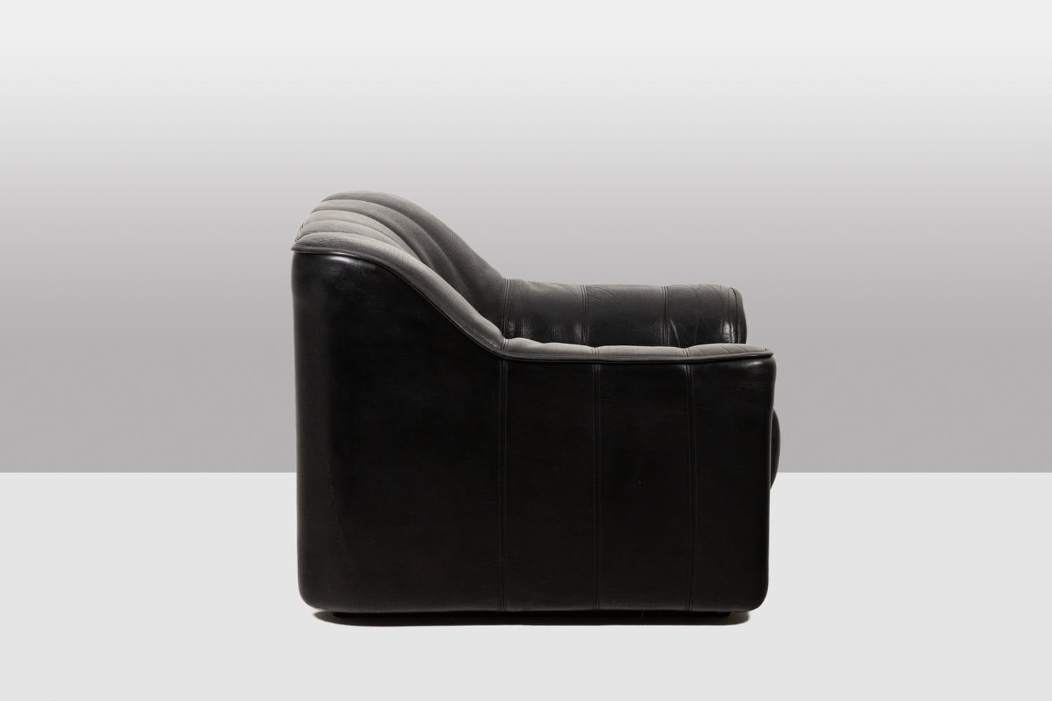 De Sede Black Leather Armchair and Ottoman - Side View - Styylish