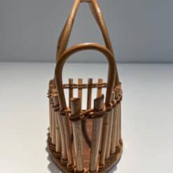 French 1970s Rattan Bottle Holder - Frontal View - Styylish
