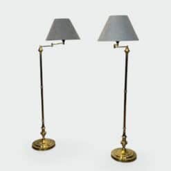 Pair of Brass Floor Reading Lamps with Articulated Arm and Grey Velvet. French Work in the Manner of Maison Jansen. Circa 1970.